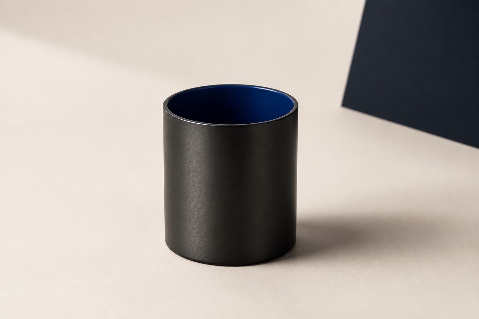 Unbranded matte-black metal desk accessory with cobalt interior